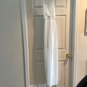 Long white Aakaa dress with slits on the side and cross back!